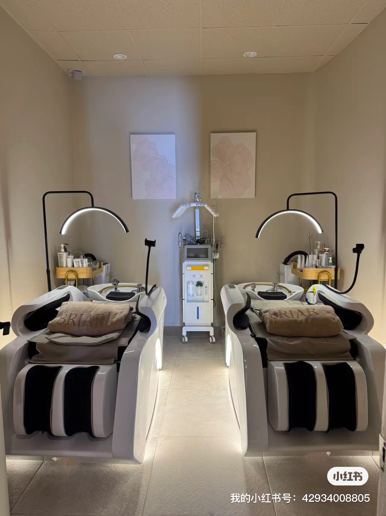 Two reclining shampoo and scalp-treatment beds with Briar towels under arched lighting